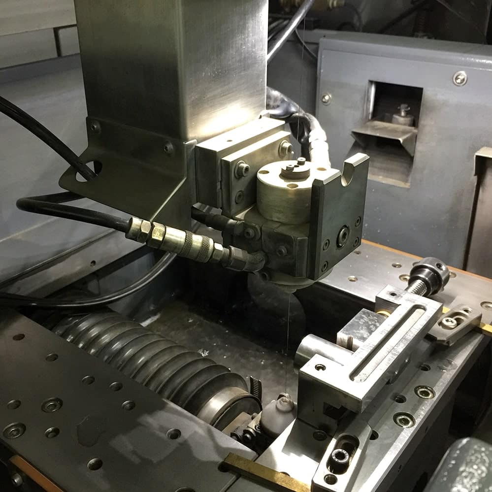 Precision manufacturing equipment cooled with deionized water chiller system