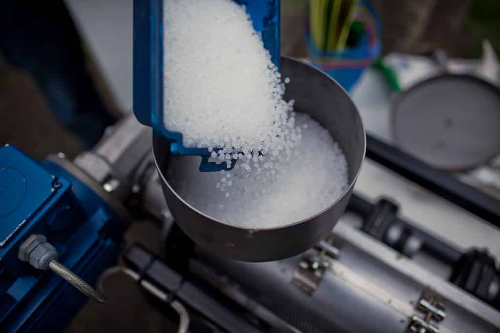 Weighing plastic particles to be prepped for injection mold