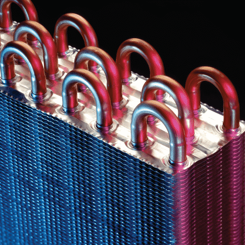 Close-up of a plate heat exchanger showing the corrugated plates used for efficient thermal transfer in cooling systems