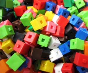 Colorful interlocking plastic blocks demonstrating injection-molded products that require chiller-cooled manufacturing