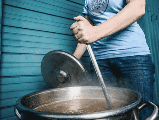 Whirlpooling technique in brewing showing the vortex that separates hops and trub from wort