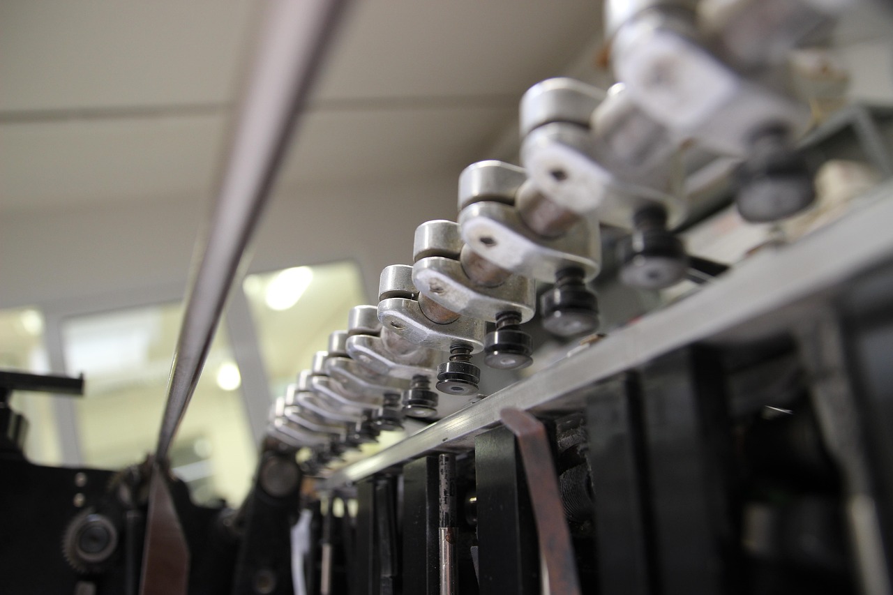 Commercial printing press machinery requiring temperature-controlled cooling for consistent print quality