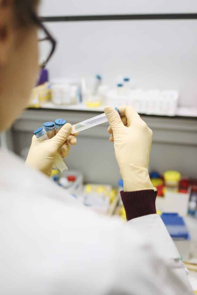Scientist in a temperature-controlled laboratory using chiller-cooled equipment