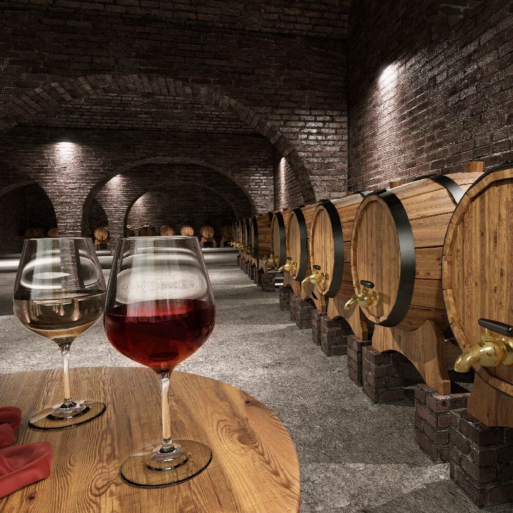 Wine glasses on table with barrels in the background
