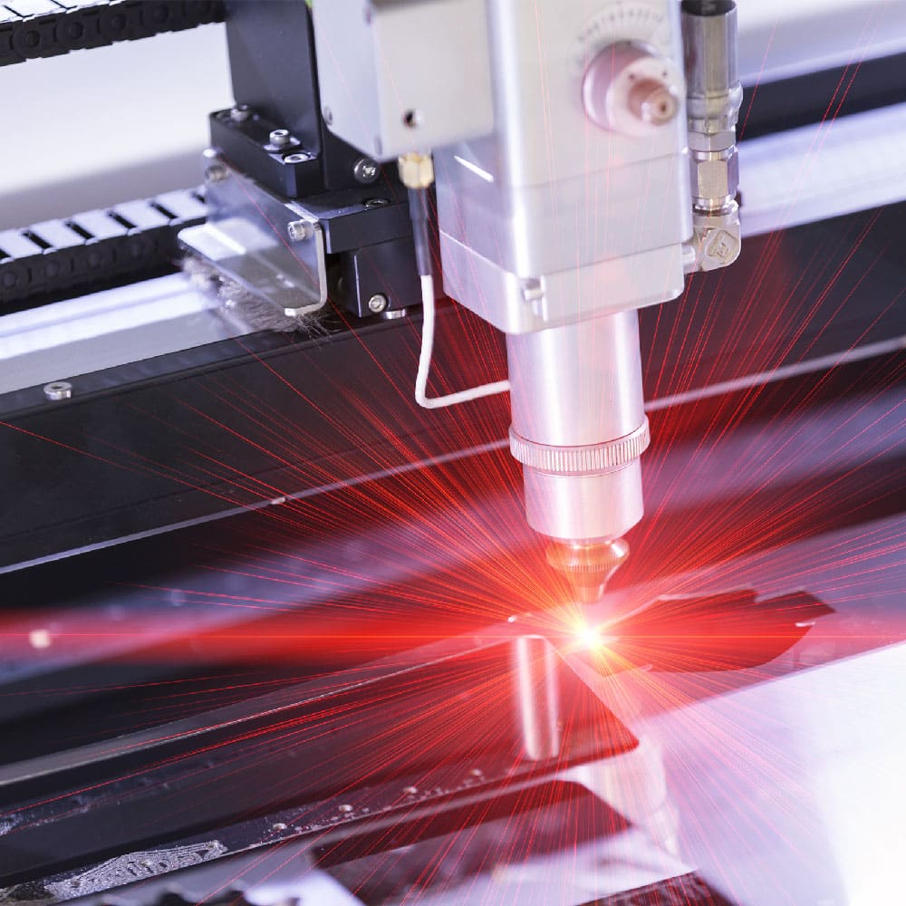 High-powered laser beam requiring precision cooling from an industrial chiller system