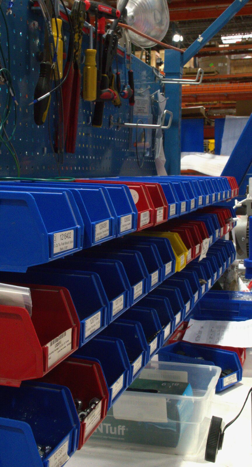 Color-coded parts bins at a workstation